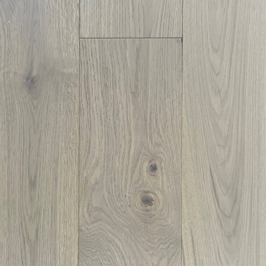 Close-up of gray wood flooring with visible grain and texture